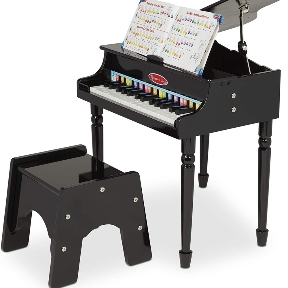 New in box. Melissa and Doug baby grand piano.